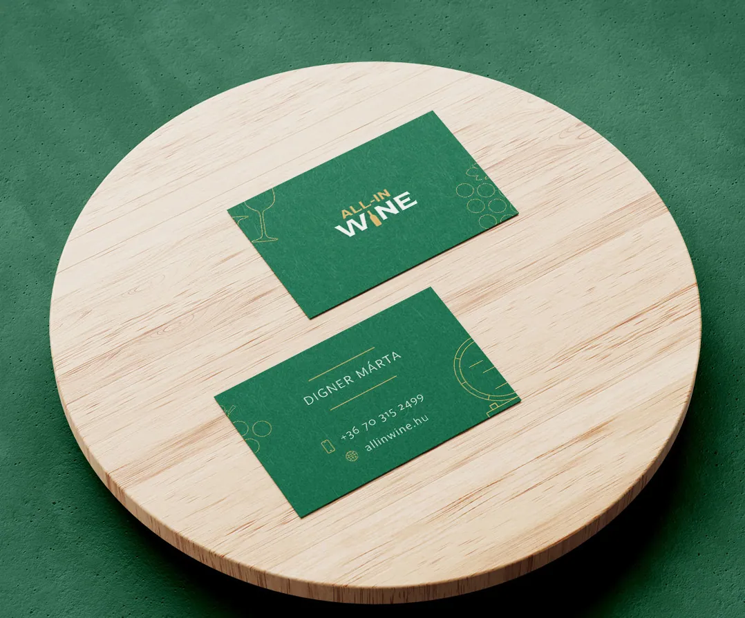 All-in Wine business cards on a wooden coaster