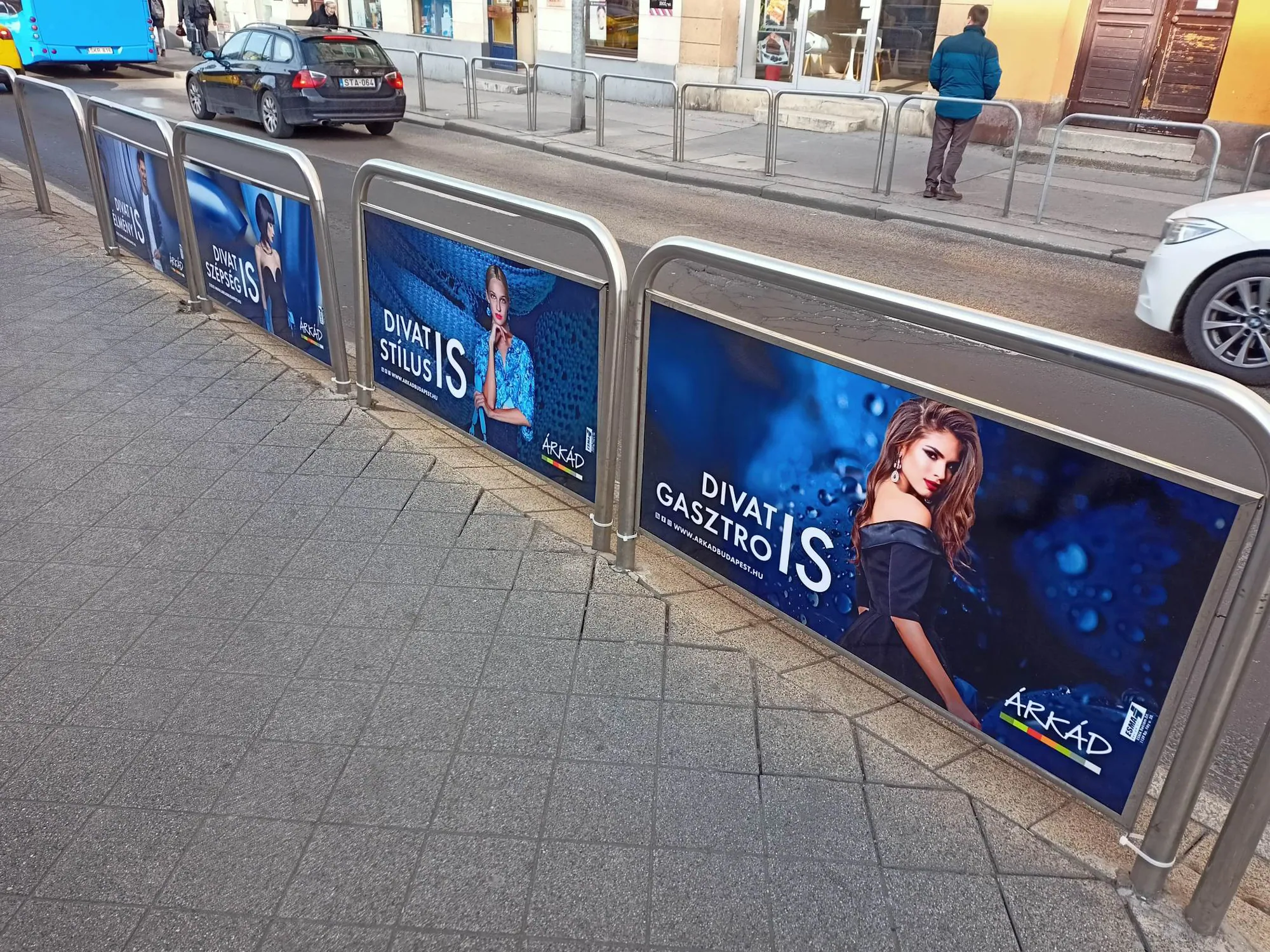 Campaign posters on a street fence